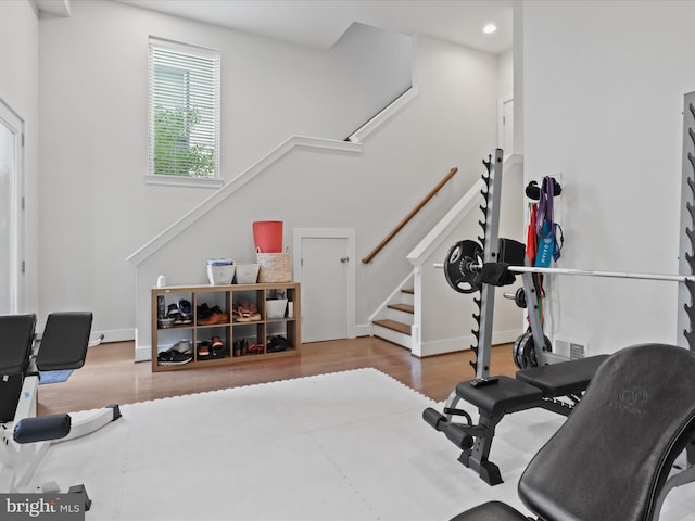 workout room with hardwood / wood-style flooring