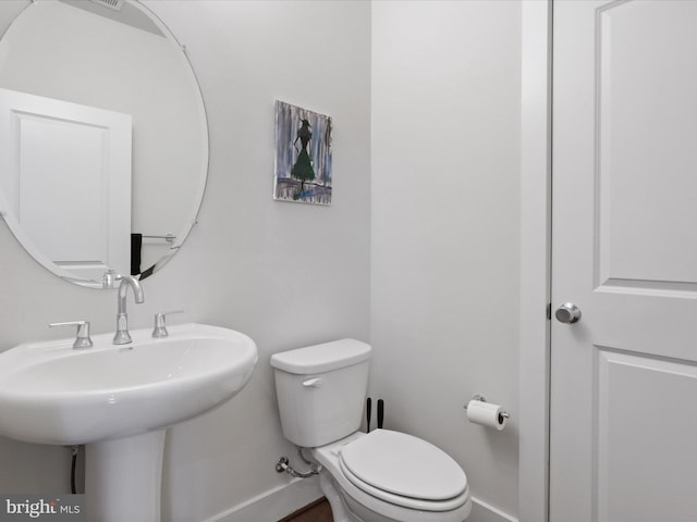 bathroom with toilet and sink