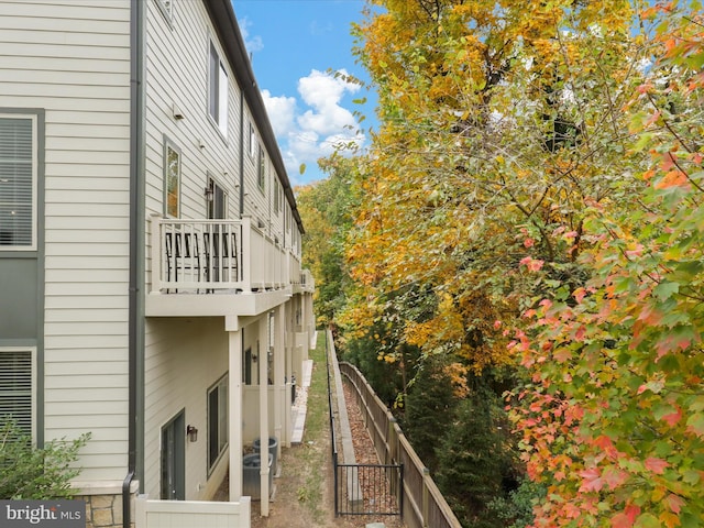 view of side of property featuring a balcony