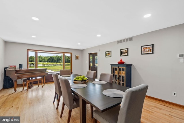 dining space featuring light hardwood / wood-style flooring