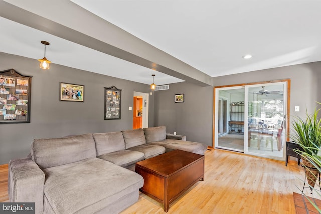 living room with light hardwood / wood-style flooring