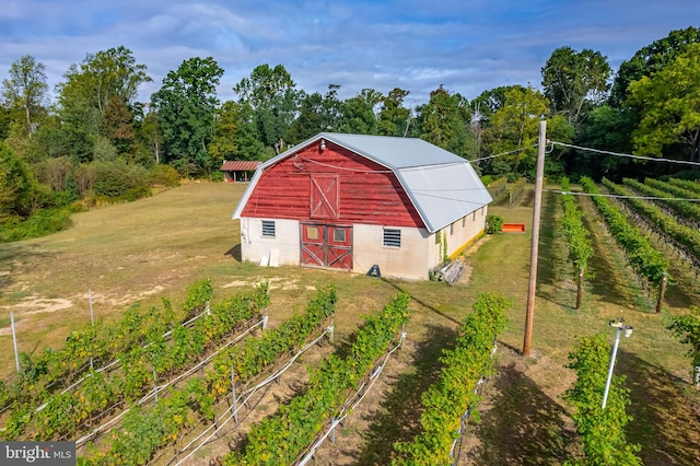 view of outdoor structure with a rural view