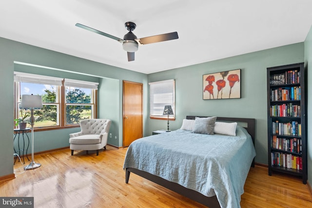 bedroom featuring hardwood / wood-style floors and ceiling fan