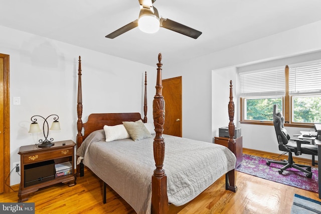 bedroom with ceiling fan and light hardwood / wood-style flooring