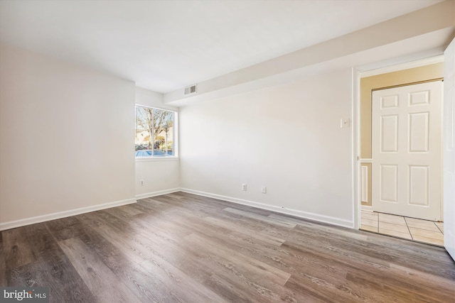 empty room featuring hardwood / wood-style floors