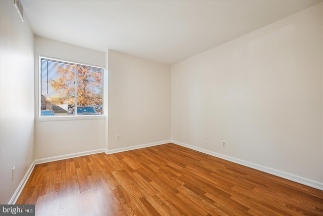 spare room featuring hardwood / wood-style floors