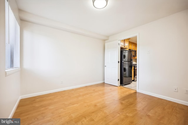 empty room with light wood-type flooring