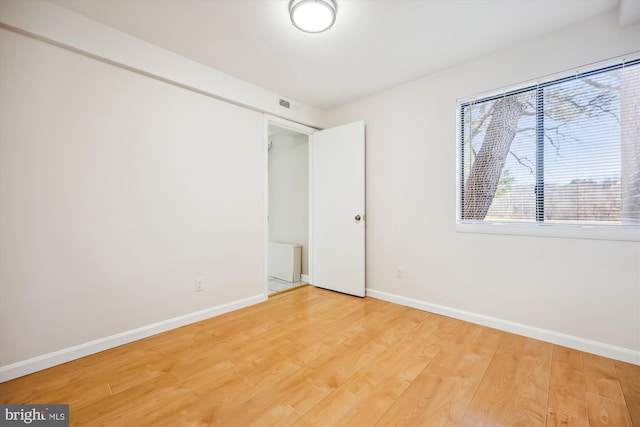 unfurnished bedroom featuring light wood-type flooring