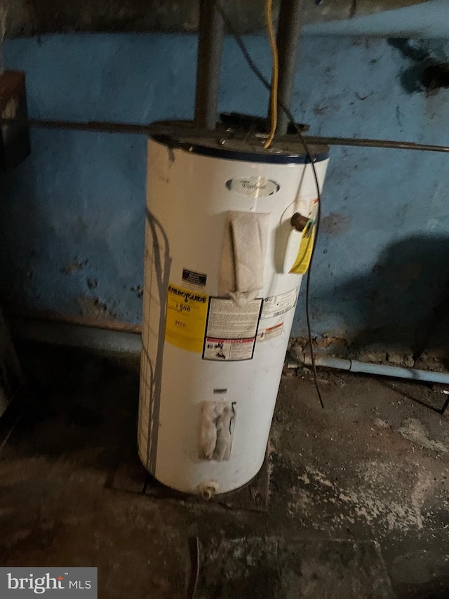 utility room featuring gas water heater