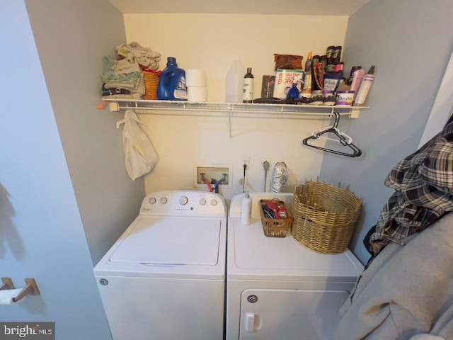 clothes washing area with washer and dryer