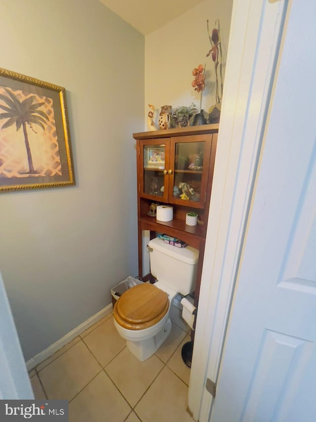 bathroom featuring toilet and tile patterned floors