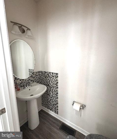 bathroom featuring hardwood / wood-style flooring