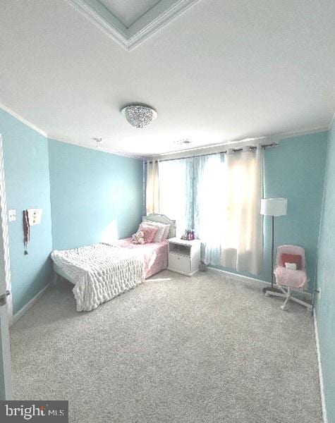 carpeted bedroom with crown molding and a textured ceiling