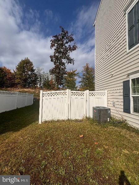 view of yard with central AC unit