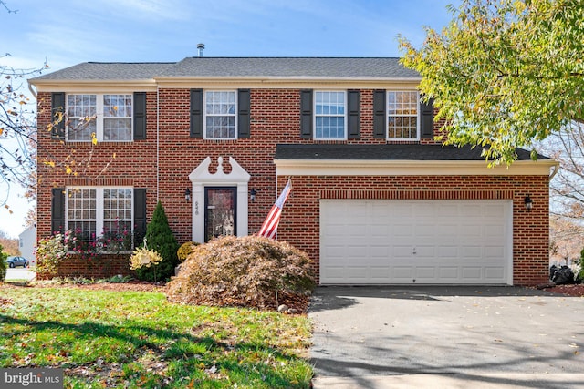 colonial home featuring a garage