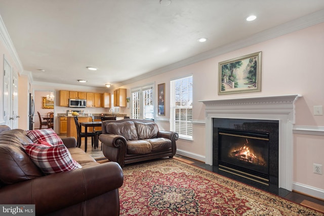 living room with ornamental molding and wood-type flooring