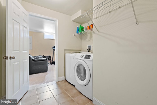 laundry area featuring independent washer and dryer and light tile patterned floors