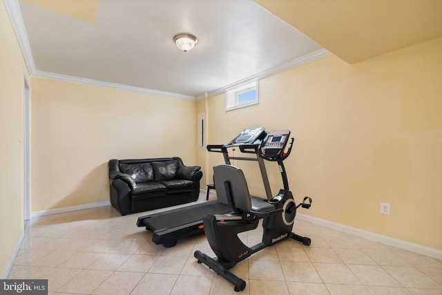 workout room featuring light tile patterned flooring and ornamental molding