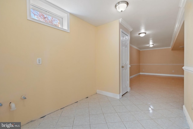 basement with ornamental molding and light tile patterned flooring