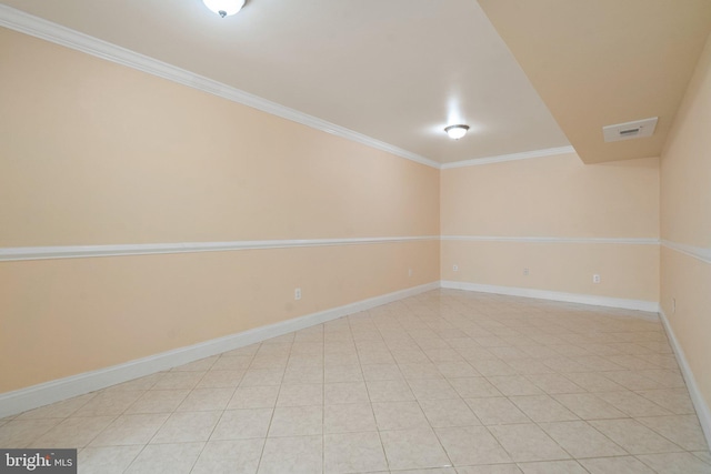 unfurnished room with light tile patterned floors and ornamental molding