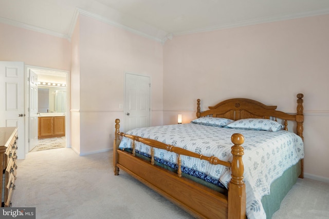 carpeted bedroom featuring connected bathroom and ornamental molding