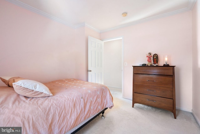 carpeted bedroom featuring crown molding