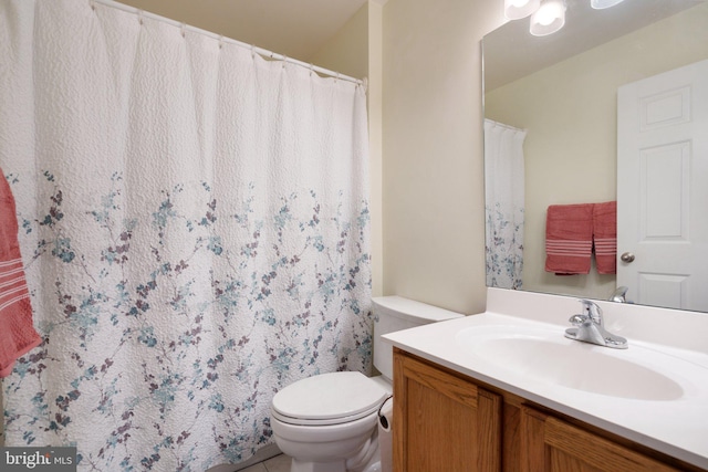 bathroom with toilet and vanity