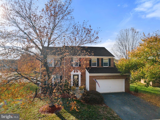 colonial home featuring a garage