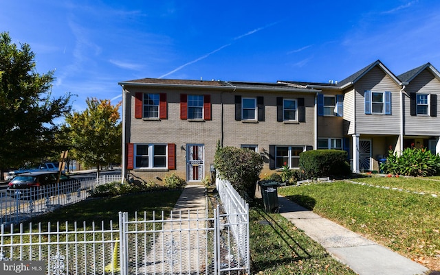 view of property featuring a front yard