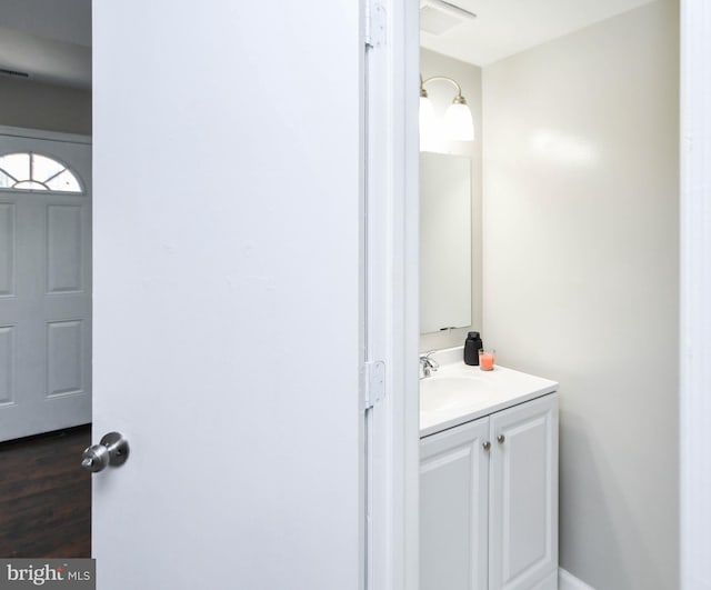 bathroom featuring vanity and hardwood / wood-style floors