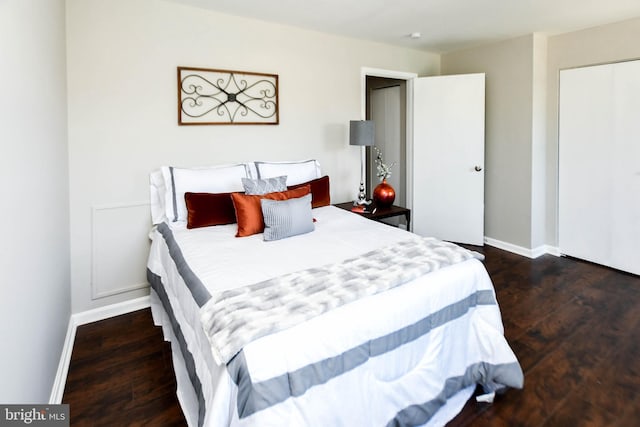 bedroom featuring dark hardwood / wood-style flooring