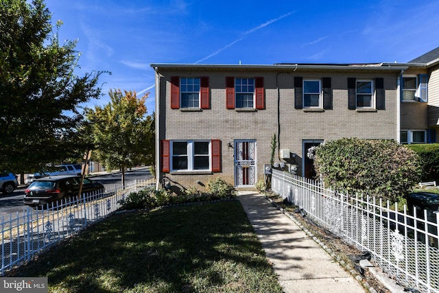 1140 1st St NW, Washington, DC 20001 - townhome / multi-family property featuring fence, a front lawn, and brick siding