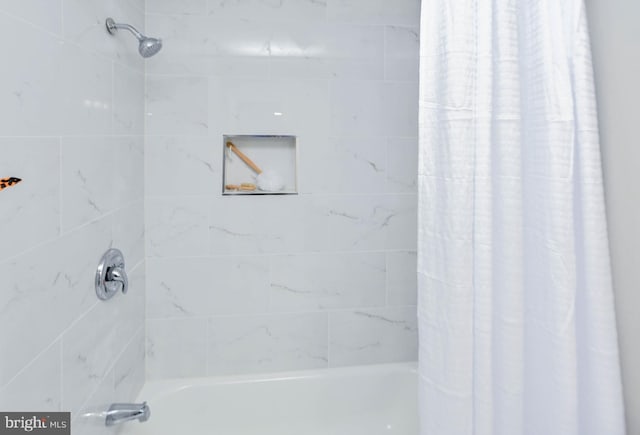 bathroom featuring shower / bath combo with shower curtain