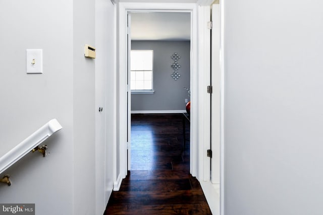 corridor featuring dark hardwood / wood-style floors