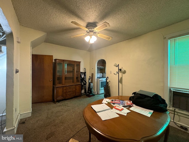 dining space featuring ceiling fan, carpet flooring, and a textured ceiling