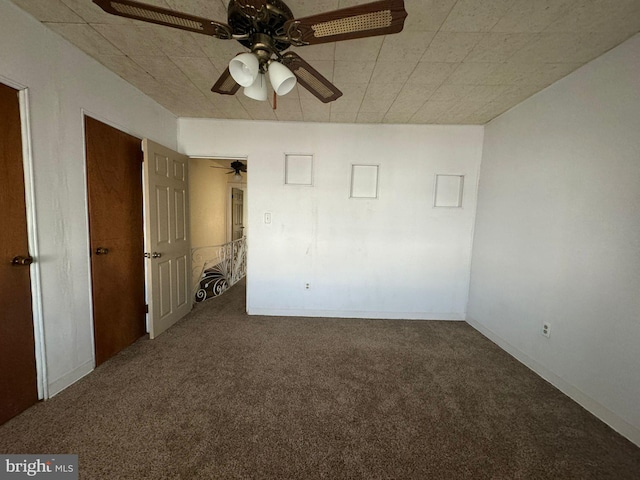 carpeted empty room with ceiling fan