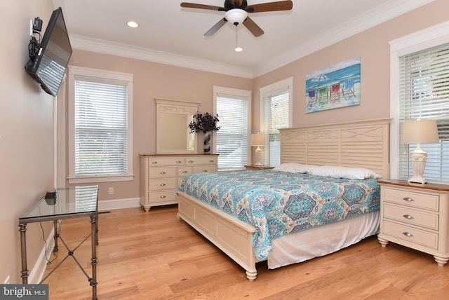 bedroom featuring crown molding, light hardwood / wood-style flooring, multiple windows, and ceiling fan