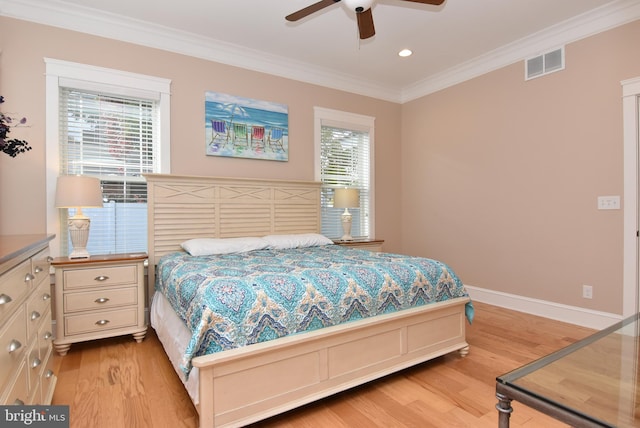 bedroom with crown molding, light hardwood / wood-style flooring, multiple windows, and ceiling fan