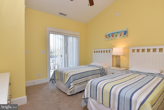 carpeted bedroom with vaulted ceiling and ceiling fan