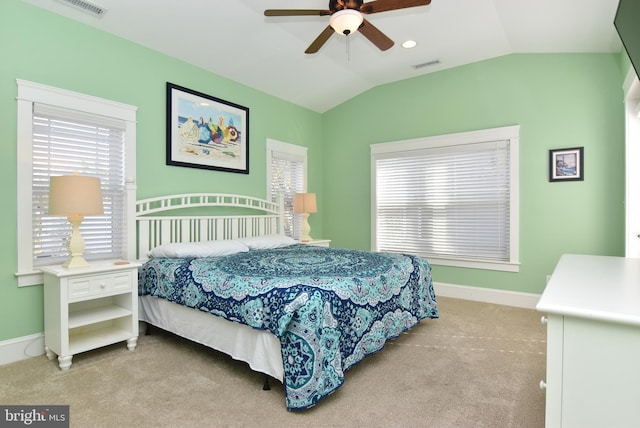 bedroom with light colored carpet, lofted ceiling, and ceiling fan