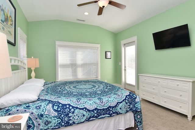 bedroom with ceiling fan, light carpet, and vaulted ceiling