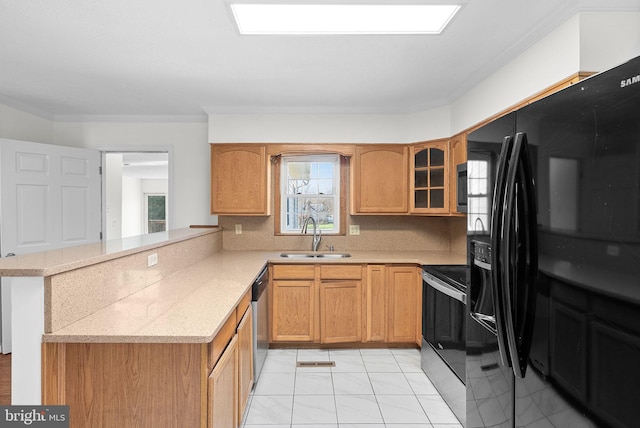 kitchen with sink, tasteful backsplash, kitchen peninsula, crown molding, and black appliances