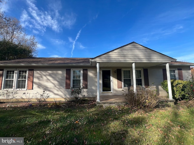 single story home featuring covered porch