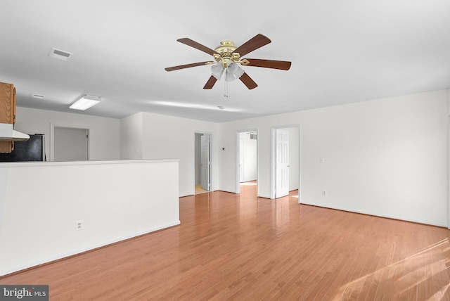 unfurnished room with light hardwood / wood-style floors and ceiling fan