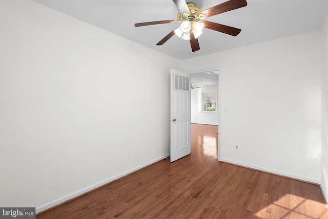 spare room featuring hardwood / wood-style flooring and ceiling fan