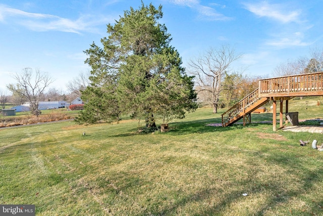 view of yard featuring a deck