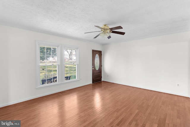 interior space with hardwood / wood-style floors and a textured ceiling