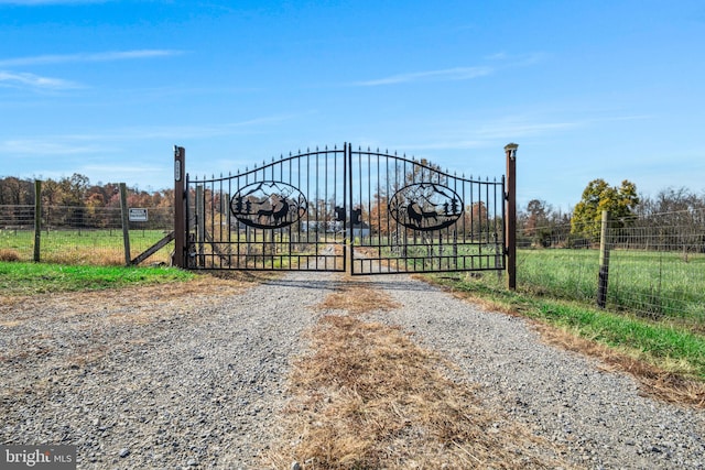 view of gate featuring fence