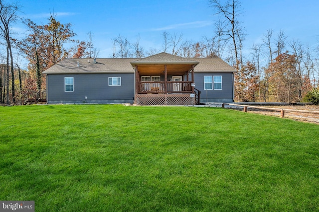 back of house with a lawn