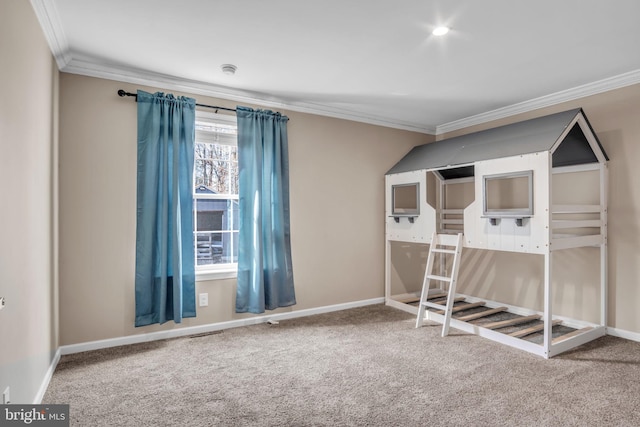 unfurnished bedroom with crown molding, carpet flooring, visible vents, and baseboards